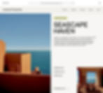 Minimalist room with terracotta accents and large windows framing a serene ocean view under a clear blue sky.